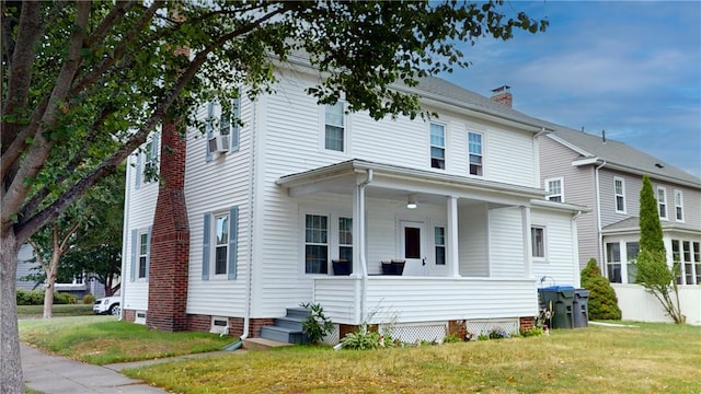 95 Burlington St, Providence, RI 02906 - american foursquare style home with a front yard, covered porch, and a chimney