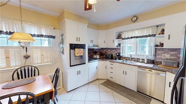 95 Burlington St, Providence, RI 02906 - kitchen featuring stainless steel appliances, plenty of natural light, a ceiling fan, and backsplash