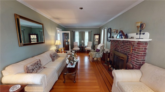 95 Burlington St, Providence, RI 02906 - living room featuring wood finished floors, a brick fireplace, and crown molding