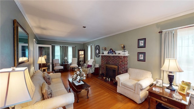 95 Burlington St, Providence, RI 02906 - living room featuring wood finished floors, a brick fireplace, and crown molding