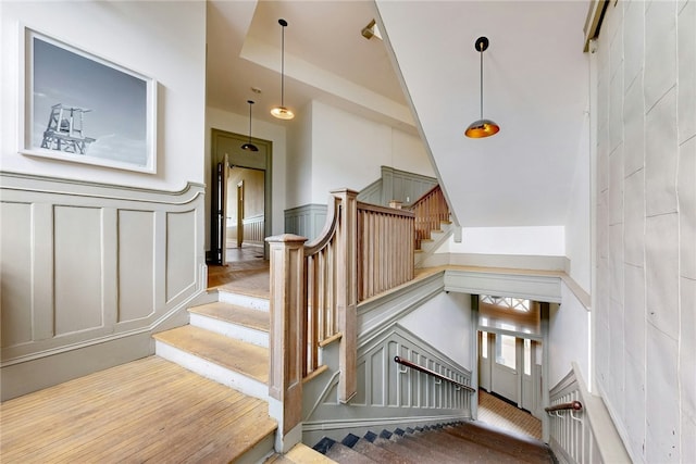 225 Weybosset St Unit 12, Providence, RI 02903 - stairs with a decorative wall, a wainscoted wall, and wood finished floors