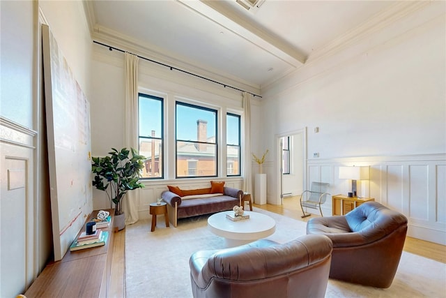 225 Weybosset St Unit 12, Providence, RI 02903 - living area featuring ornamental molding, wood finished floors, beam ceiling, and a decorative wall