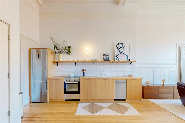225 Weybosset St Unit 12, Providence, RI 02903 - kitchen featuring appliances with stainless steel finishes, light brown cabinets, light wood-style floors, open shelves, and light countertops