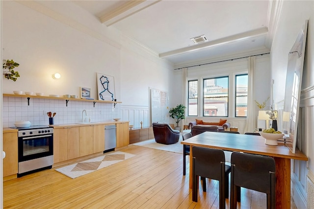 225 Weybosset St Unit 12, Providence, RI 02903 - kitchen with appliances with stainless steel finishes, light brown cabinetry, beam ceiling, light wood-style floors, and open shelves