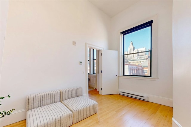 225 Weybosset St Unit 12, Providence, RI 02903 - sitting room featuring a baseboard radiator and light wood-type flooring