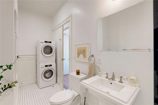 225 Weybosset St Unit 12, Providence, RI 02903 - bathroom featuring stacked washer / dryer and tile patterned flooring