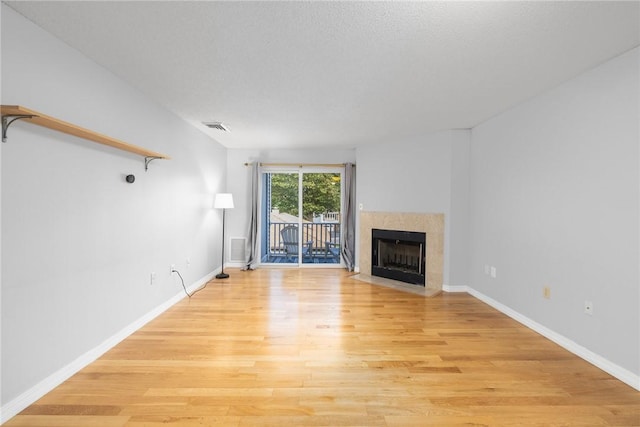 1800 Douglas Ave Unit 304, North Providence, RI 02904 - unfurnished living room featuring light wood-style flooring and a fireplace with flush hearth