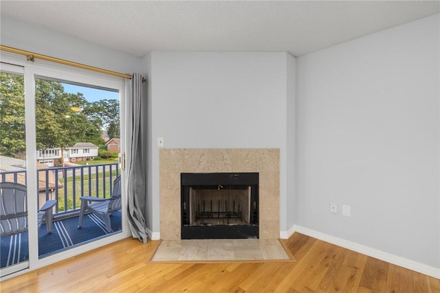 1800 Douglas Ave Unit 304, North Providence, RI 02904 - detailed view of wood finished floors and a tile fireplace