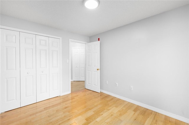 1800 Douglas Ave Unit 304, North Providence, RI 02904 - unfurnished bedroom with light wood-style flooring and a closet