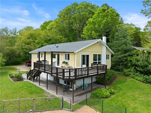 106 Lauri Dr, Charlestown, RI 02813 - back of property with a wooden deck, a chimney, a shingled roof, and a gate