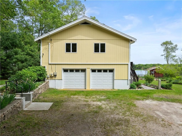 106 Lauri Dr, Charlestown, RI 02813 - view of side of home with a detached garage and stairs