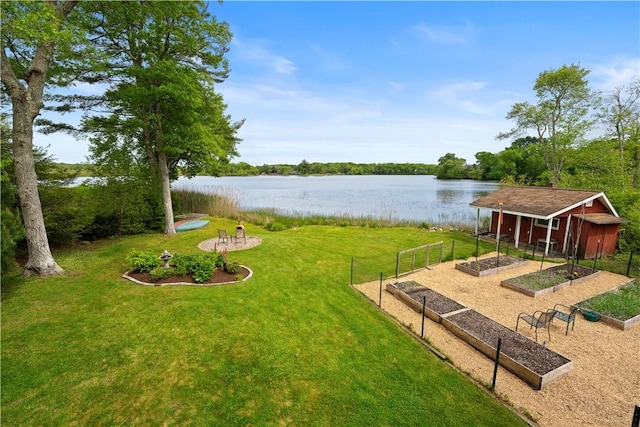 106 Lauri Dr, Charlestown, RI 02813 - view of green lawn with a vegetable garden and a water view