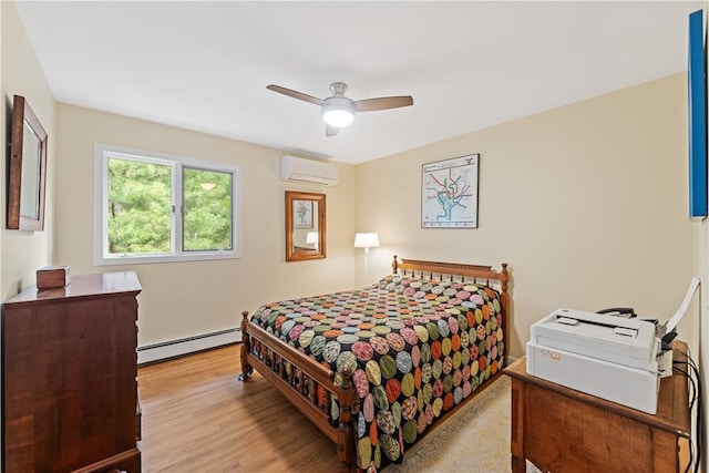 106 Lauri Dr, Charlestown, RI 02813 - bedroom with an AC wall unit, a baseboard radiator, light wood-type flooring, and ceiling fan