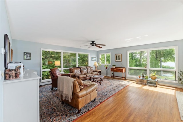 106 Lauri Dr, Charlestown, RI 02813 - living area with wood finished floors and a ceiling fan