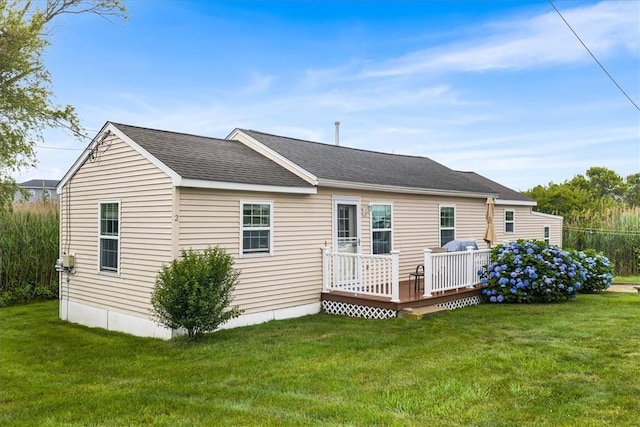 2 Geraldine Blvd, Narragansett, RI 02882 - back of property featuring a deck, a lawn, and roof with shingles