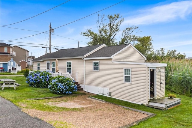 2 Geraldine Blvd, Narragansett, RI 02882 - view of home's exterior with a lawn and roof with shingles