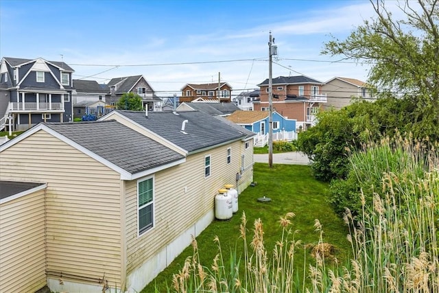 2 Geraldine Blvd, Narragansett, RI 02882 - view of home's exterior with a residential view, roof with shingles, and a yard