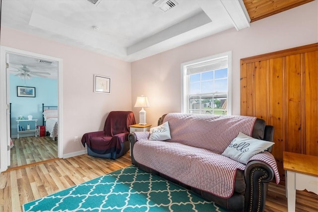2 Geraldine Blvd, Narragansett, RI 02882 - living area featuring light wood-style flooring, a tray ceiling, and a ceiling fan