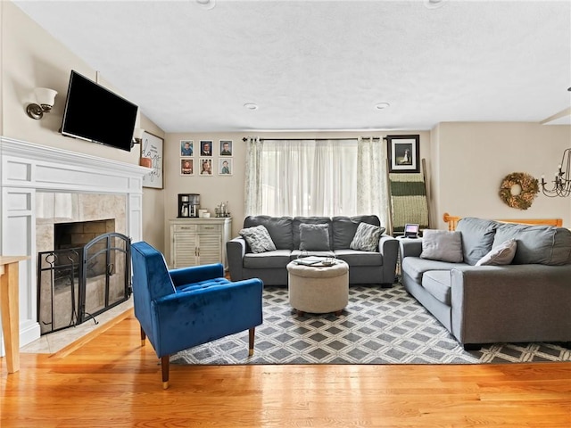 15 Sycamore Dr, West Warwick, RI 02893 - living room featuring light wood finished floors and a tiled fireplace