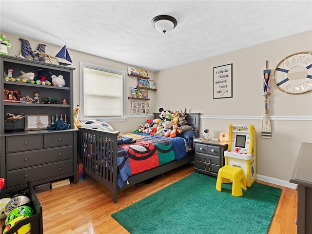 15 Sycamore Dr, West Warwick, RI 02893 - bedroom featuring wood finished floors and a textured ceiling