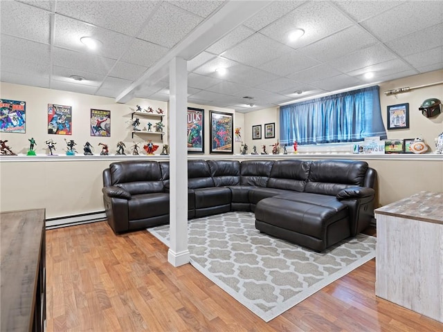 15 Sycamore Dr, West Warwick, RI 02893 - living room featuring a baseboard heating unit, wood finished floors, and a drop ceiling