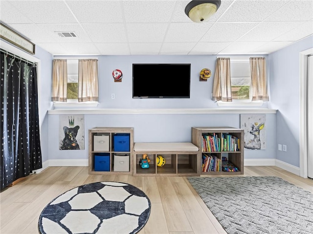 15 Sycamore Dr, West Warwick, RI 02893 - sitting room featuring a drop ceiling, wood finished floors, and healthy amount of natural light