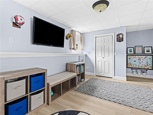 15 Sycamore Dr, West Warwick, RI 02893 - recreation room with wood finished floors and a drop ceiling
