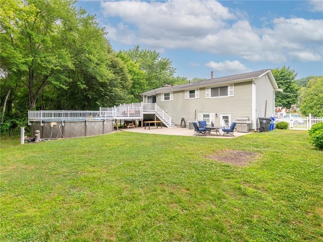 15 Sycamore Dr, West Warwick, RI 02893 - rear view of property with a wooden deck, an outdoor pool, a patio, and stairs