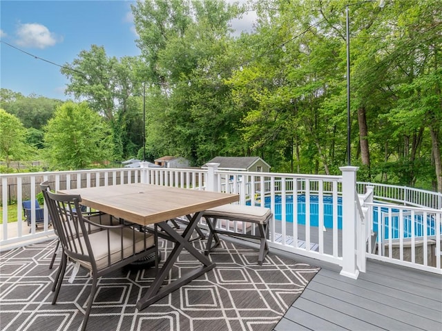 15 Sycamore Dr, West Warwick, RI 02893 - wooden terrace featuring outdoor dining space and a storage unit