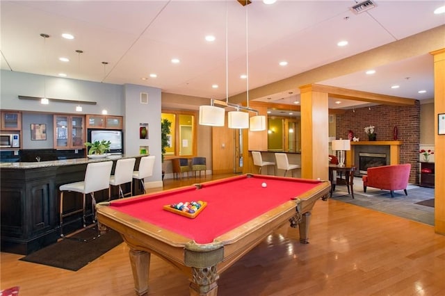 1000 Providence Pl Unit 449, Providence, RI 02903 - recreation room featuring wood finished floors, a community bar, billiards, recessed lighting, and a fireplace