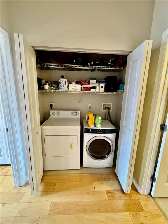 1000 Providence Pl Unit 449, Providence, RI 02903 - washroom featuring independent washer and dryer and light wood-type flooring
