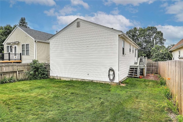 28 Plant St, Cumberland, RI 02864 - view of property exterior featuring a fenced backyard and a deck