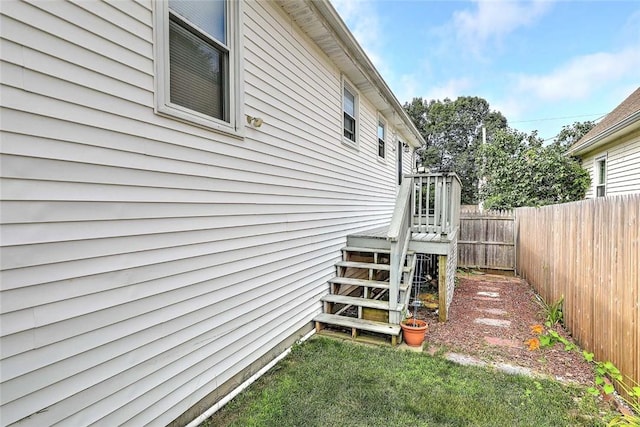 28 Plant St, Cumberland, RI 02864 - view of property exterior featuring a fenced backyard, stairway, and a wooden deck
