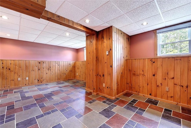 28 Plant St, Cumberland, RI 02864 - below grade area with a drop ceiling, wooden walls, a wainscoted wall, and recessed lighting