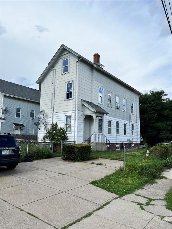35 Appleton Ave, Pawtucket, RI 02860 - view of home's exterior with a chimney