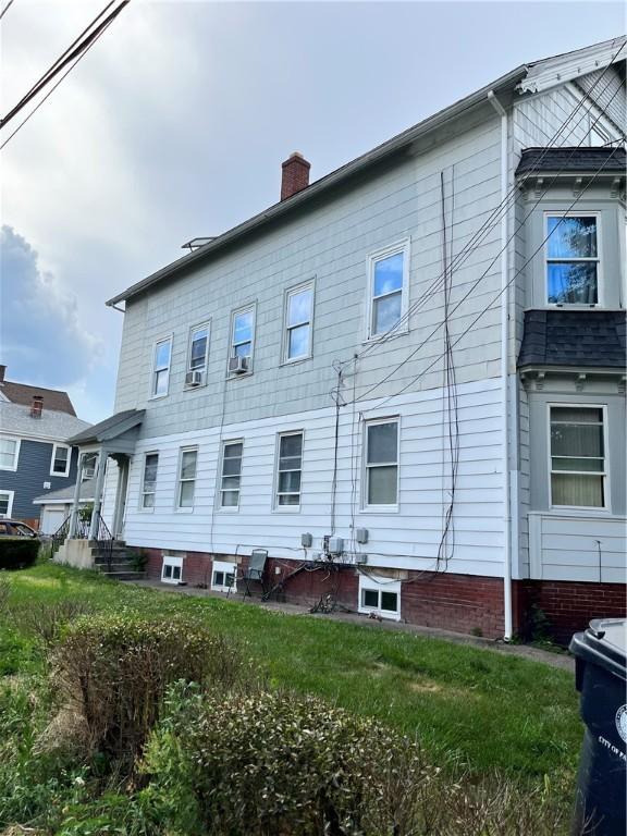 35 Appleton Ave, Pawtucket, RI 02860 - rear view of house featuring a chimney