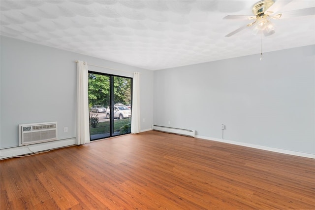 750 Quaker Ln Unit B112, Warwick, RI 02818 - unfurnished room with baseboard heating, wood finished floors, a wall mounted AC, and a ceiling fan