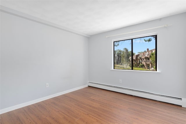 750 Quaker Ln Unit B112, Warwick, RI 02818 - empty room featuring baseboard heating and wood finished floors