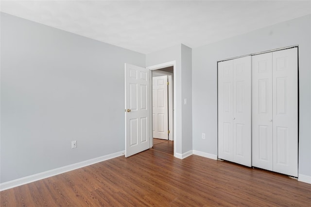 750 Quaker Ln Unit B112, Warwick, RI 02818 - unfurnished bedroom featuring wood finished floors and a closet