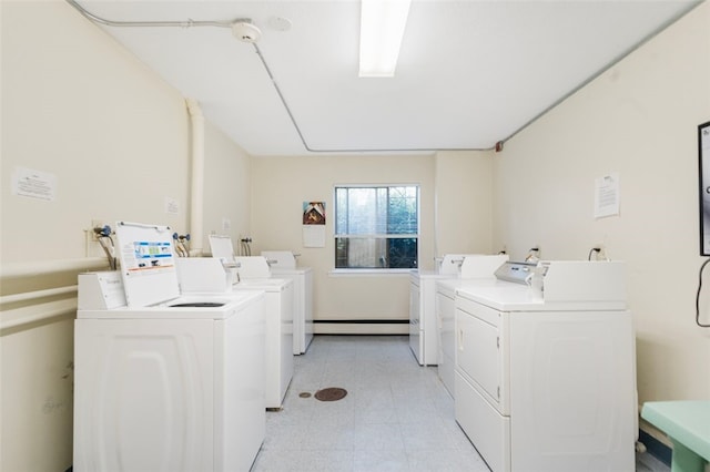 750 Quaker Ln Unit B112, Warwick, RI 02818 - communal laundry room with washer and clothes dryer, light floors, and baseboard heating