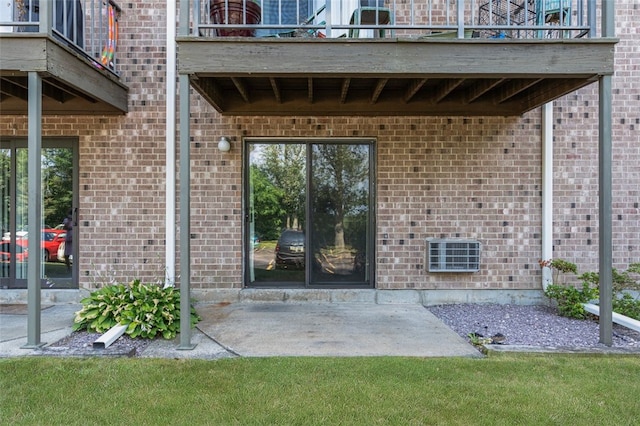 750 Quaker Ln Unit B112, Warwick, RI 02818 - entrance to property with a balcony, a patio area, and brick siding