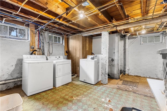 38 Vine St, East Providence, RI 02914 - below grade area with washing machine and clothes dryer and light flooring