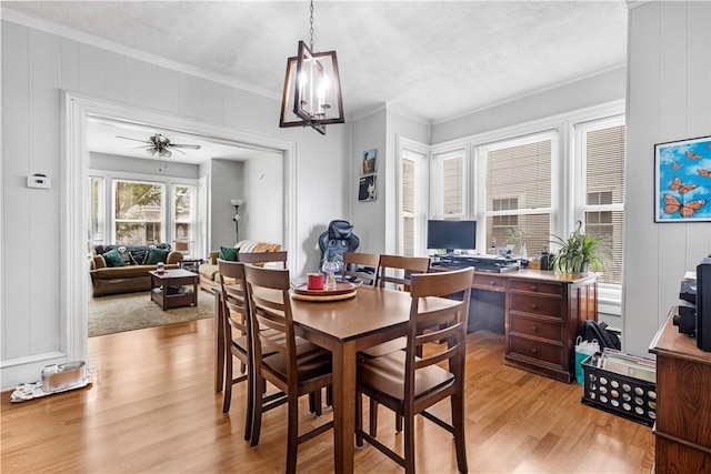38 Vine St, East Providence, RI 02914 - dining space featuring ornamental molding, light wood finished floors, an office area, a decorative wall, and ceiling fan