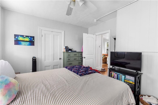 38 Vine St, East Providence, RI 02914 - bedroom with wood finished floors, a ceiling fan, and a decorative wall