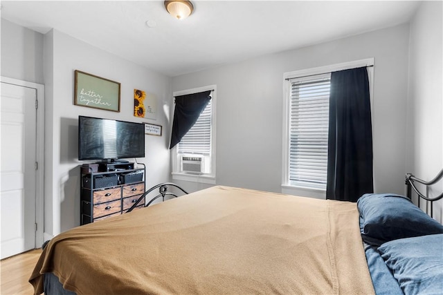 38 Vine St, East Providence, RI 02914 - bedroom featuring multiple windows, cooling unit, and wood finished floors