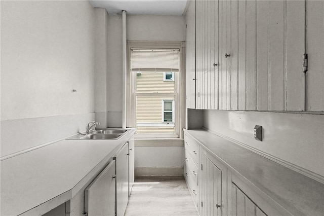 230 Pawtucket Ave, Pawtucket, RI 02860 - kitchen with light wood-type flooring, light countertops, and white cabinets
