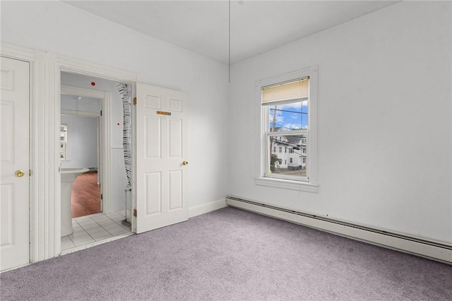 230 Pawtucket Ave, Pawtucket, RI 02860 - unfurnished bedroom with baseboard heating, light carpet, and light tile patterned floors