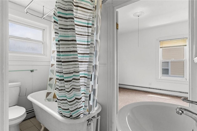 230 Pawtucket Ave, Pawtucket, RI 02860 - bathroom featuring a baseboard radiator, a soaking tub, tile patterned floors, and curtained shower