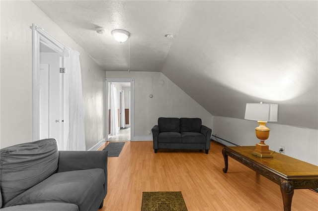 230 Pawtucket Ave, Pawtucket, RI 02860 - living room featuring baseboard heating, lofted ceiling, and light wood-type flooring