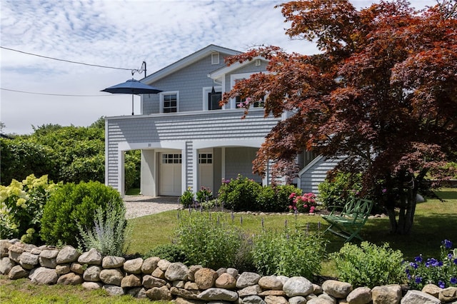 21 Overlook Ave, Charlestown, RI 02813 - view of front of home with driveway, a garage, and a front yard